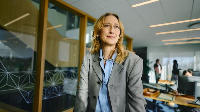 Business woman standing optimistic at a business office small